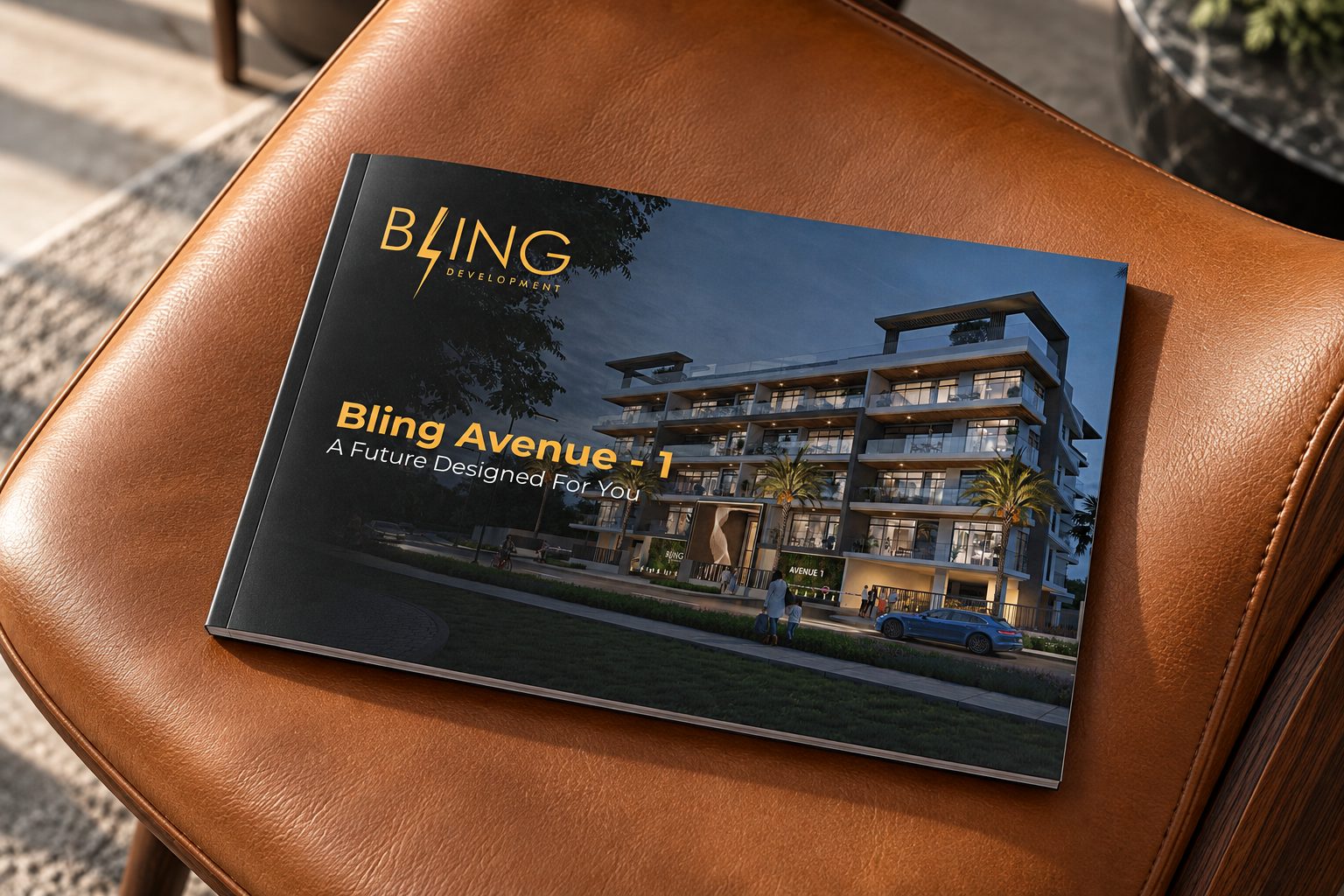 Bling Avenue 1 brochure cover resting on a tan leather chair